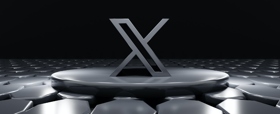 © BoliviaInteligente - Unsplash , X-Logo auf rundem Element, grau, vor dunklem Hintergrund