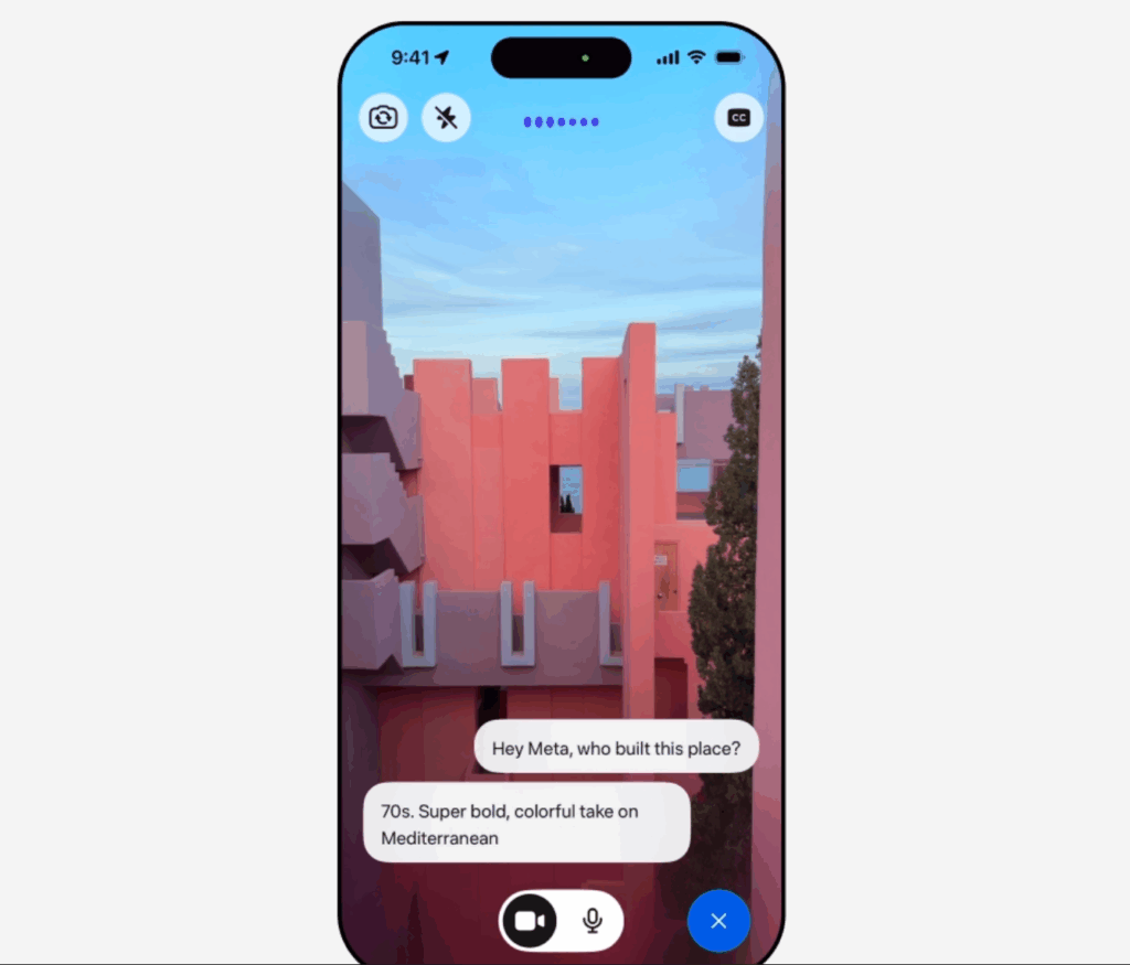 Meta AI analysiert per Smartphone Kamera ein rosafarbenes Gebäude und beantwortet Fragen zur Architektur.
